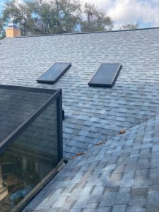 new asphalt replacement roof with skylights