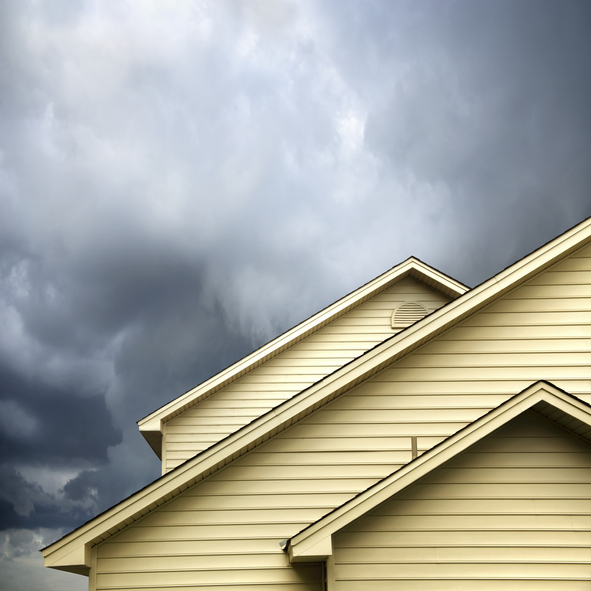 roof of a house under stormy skies