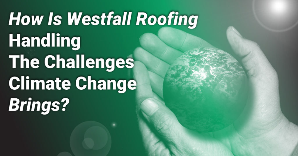 hands holding the world with the caption How Is Westfall Roofing Handling The Challenges Climate Change Brings?