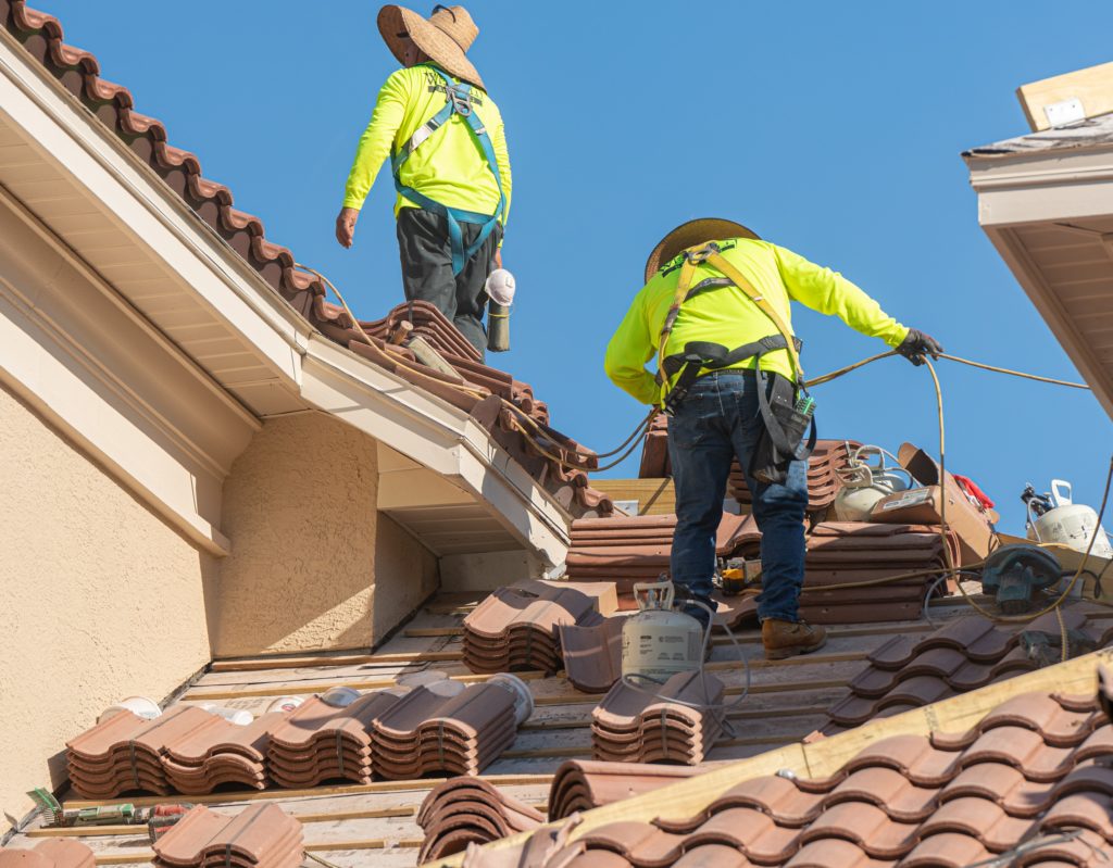 Working on a tile Roof