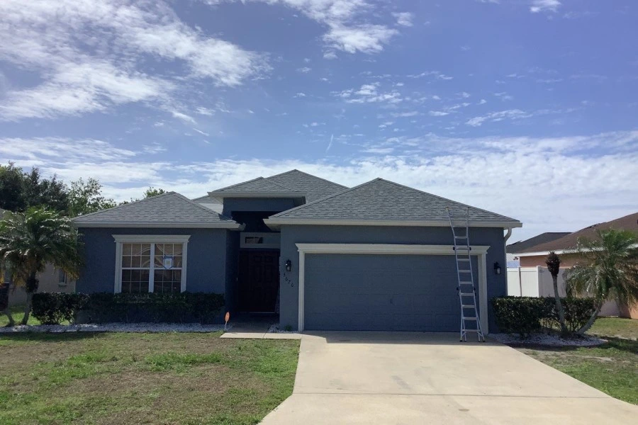 Blue home woth new hip roof