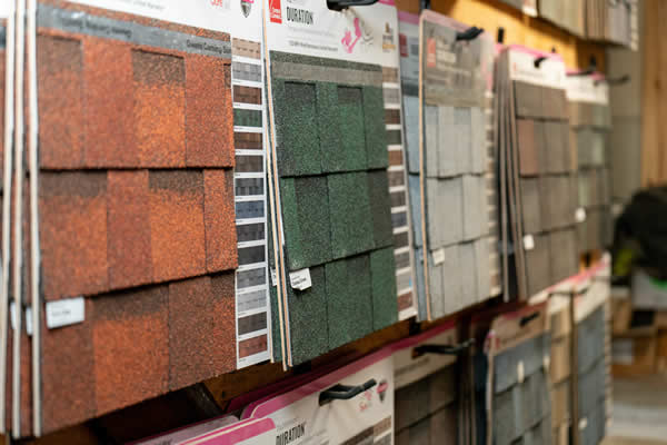 Asphalt shingle example packages hung on display 