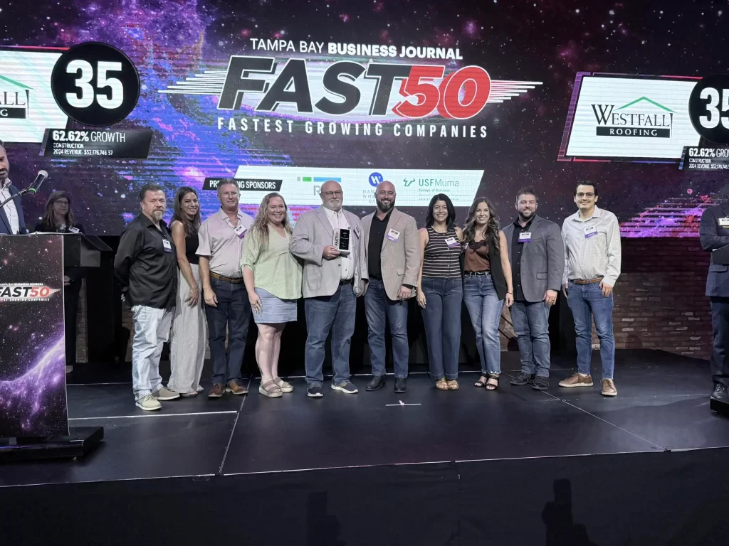 Westfall Roofing on stage at Fast 50.